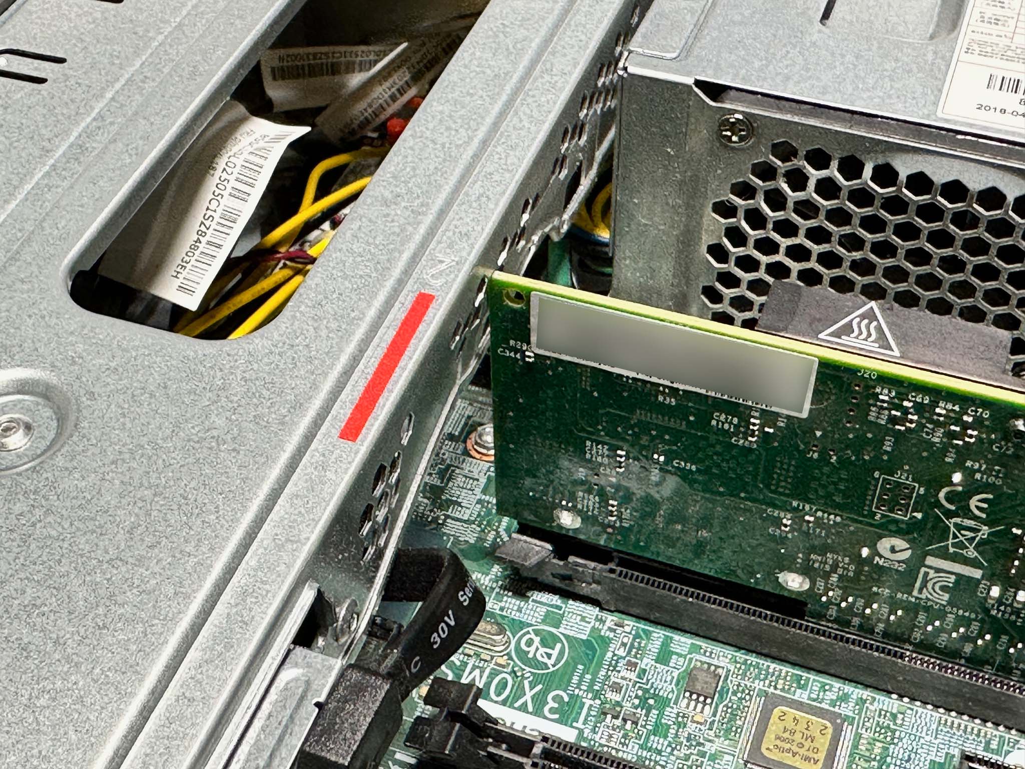 NIC installed in computer with slightly bent hard drive cage